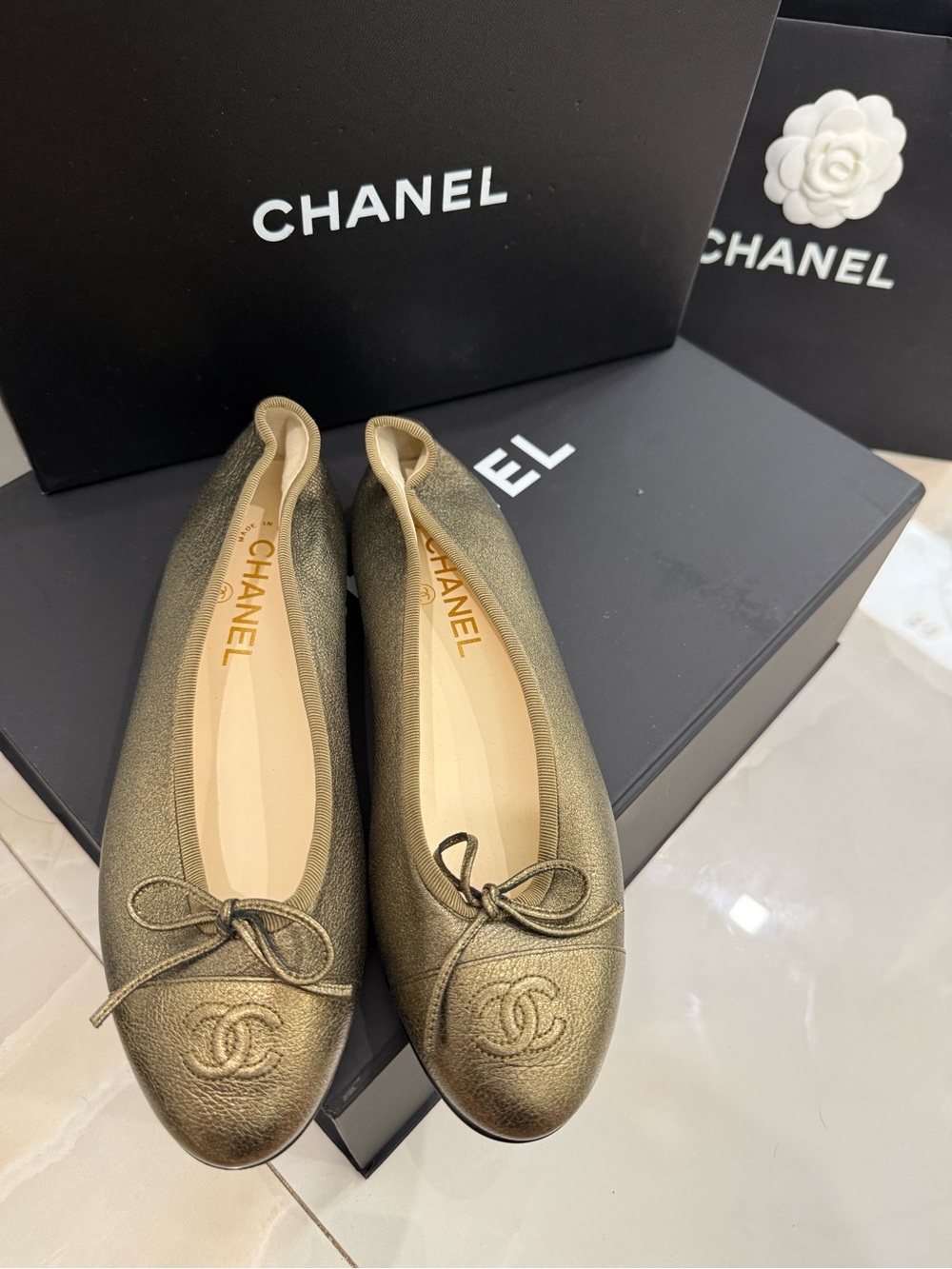 CHANEL Metallic Bronze Leather Ballet Flats with CC Emblem